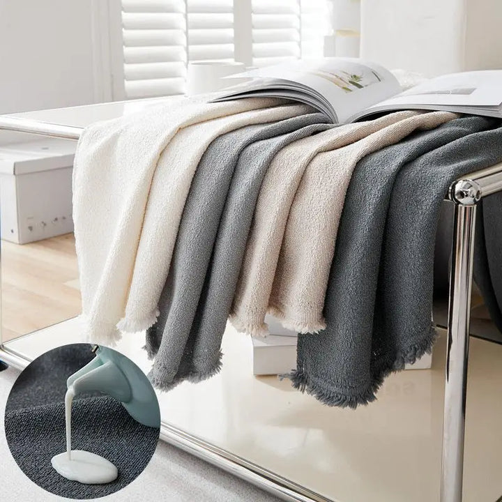 Greer Quilted Couch Cover, water resistance detail
