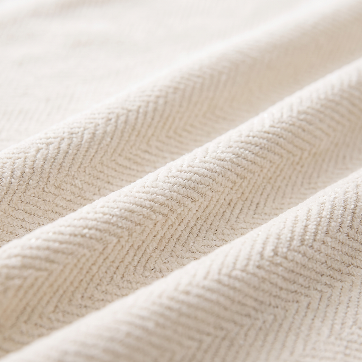 Thea Herringbone Chenille Couch Cover, fabric close up with tassels